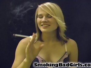 Teen smokes long white cigarette