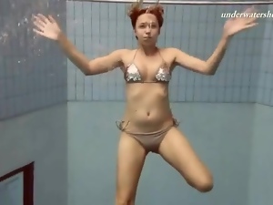 Beauty strips off her sparkly bikini in pool