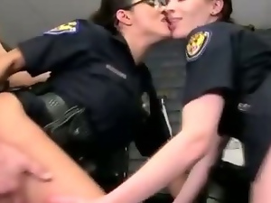 Two female cops in uniform enjoy anal sex