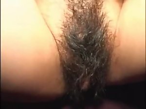 Asian chick shows off her hairy cunt and gives a blowjob