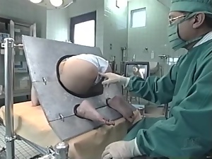 Japanese chick gets her snatch toyed at the proctologist's