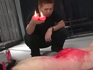 Red candle drips are all over this Japanese's ass