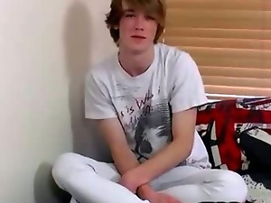 Blonde emo teen talks to the camera and then removes his clothes