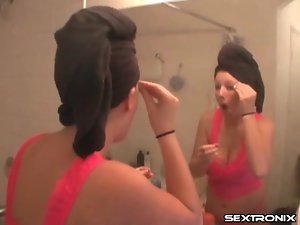 Busty girl does her makeup after shower