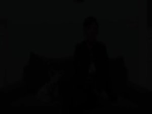 Dark haired lass masturbating on aged couch