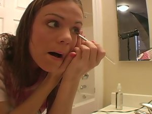 Cute teen does her makeup and talks dirty
