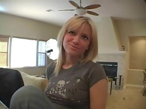Cute girl in jeans sings for the camera