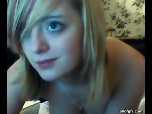 Pretty blonde amateur teen flashes her tits for the webcam