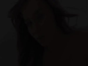 darkhair slutty girl teasing and posing on bed