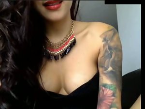 large melons tattooed lass on webcam