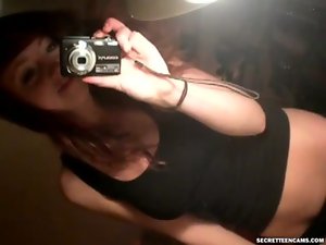 girlie with enormous boobs fingering herself