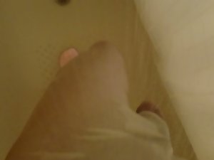 white leggings and flip flops in the bathtub