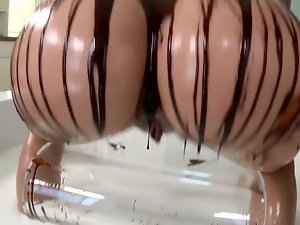 Blond covers herself and her man in chocolate. She eats cum as well