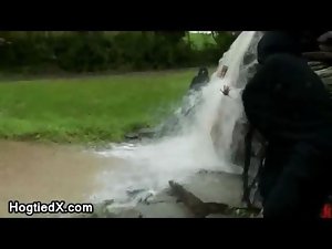 Mega boobs tied up young lady under waterfall at so cold day