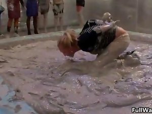Luscious blondie gets covered in filthy mud