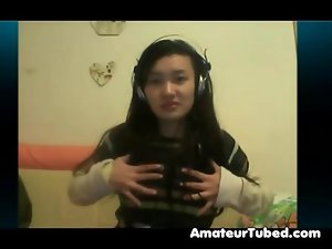 Chinese girlie plays on cam